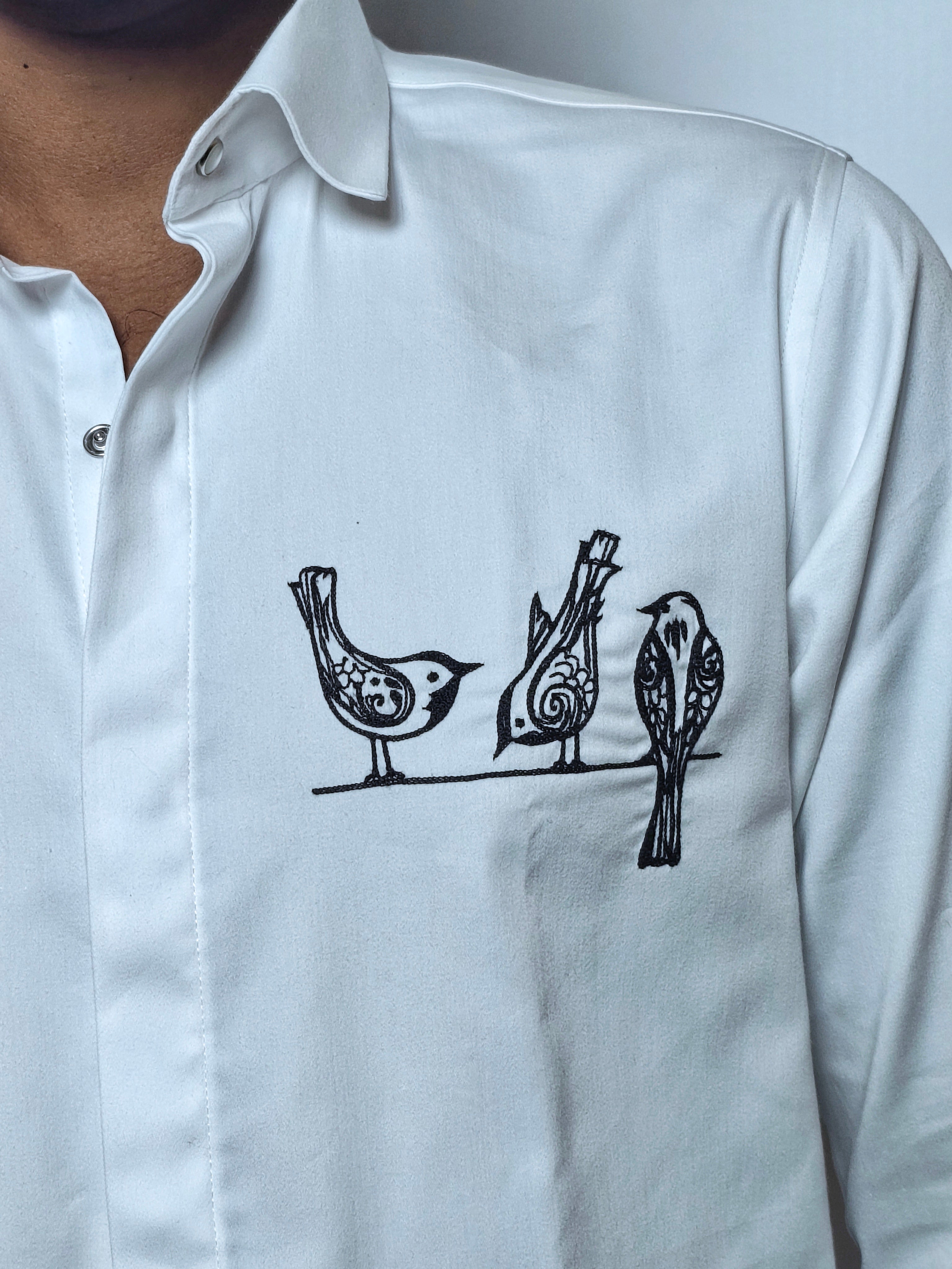 Artistic bird motif embroidery.