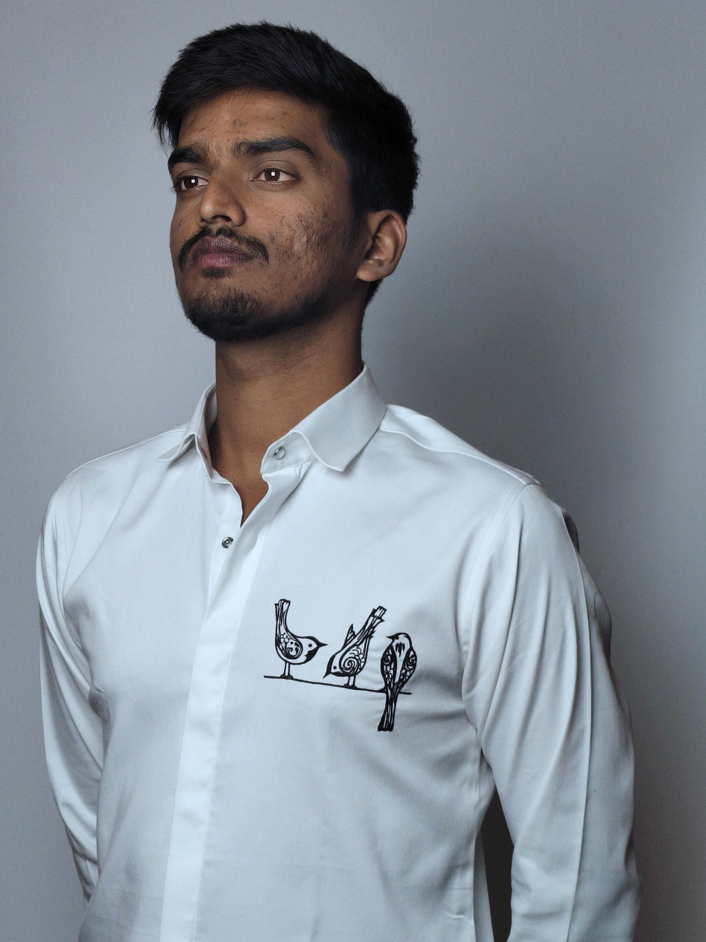 Artistic bird motif embroidery.